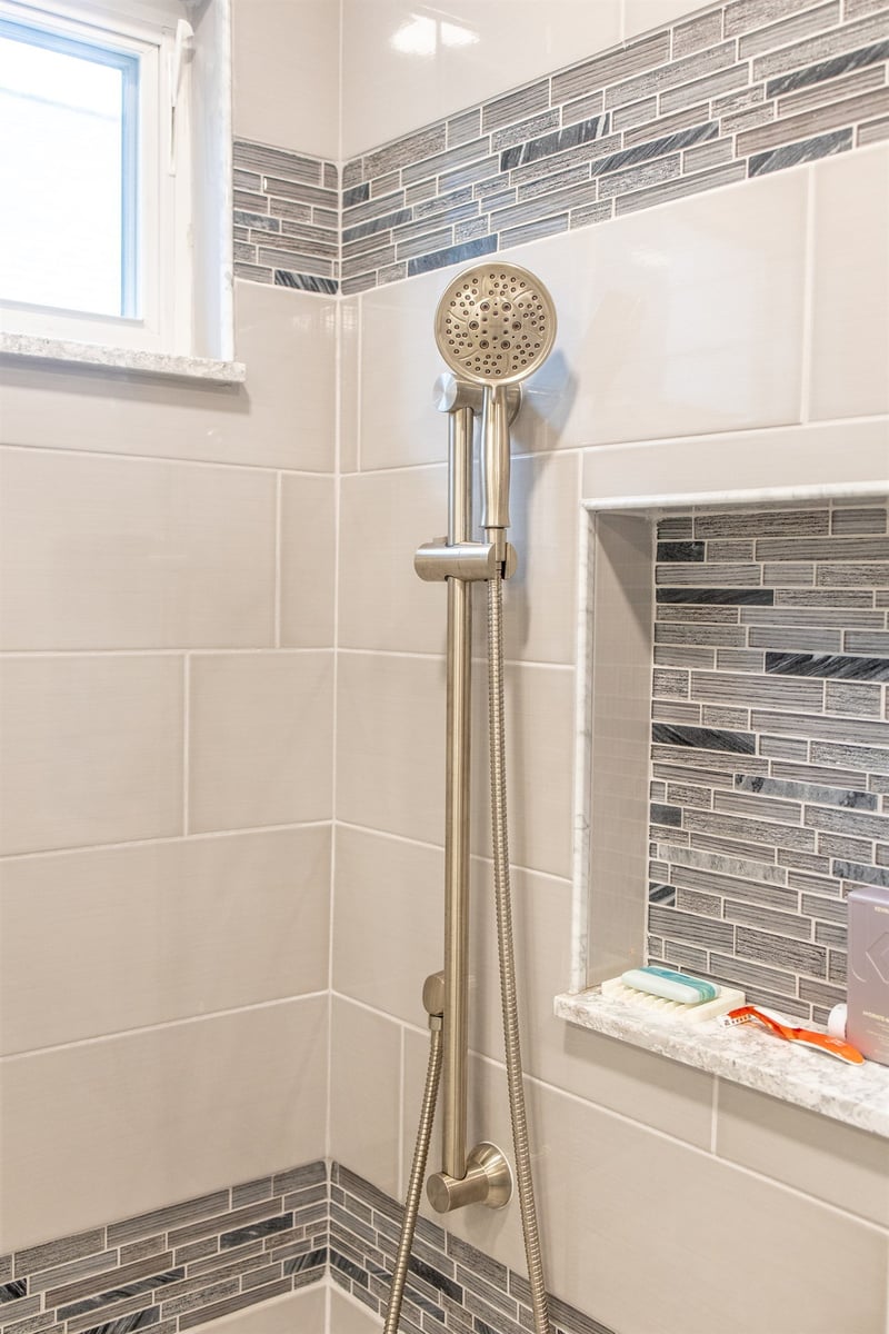 tiled-shower-with-a-handheld-sprayer-and-a-recessed-niche-southeast-mi-optimized
