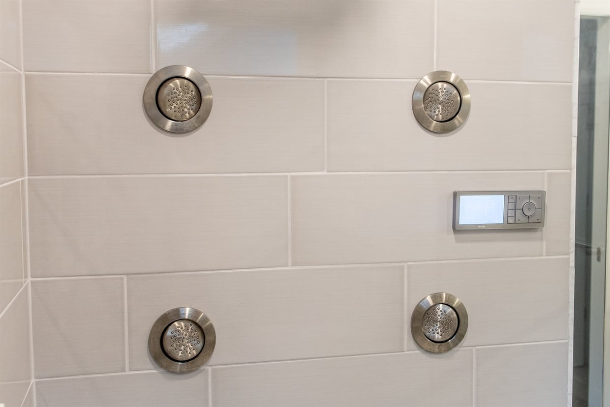 white-tiled-shower-wall-with-multiple-body-spray-jets-and-a-digital-control-southeast-mi-optimized