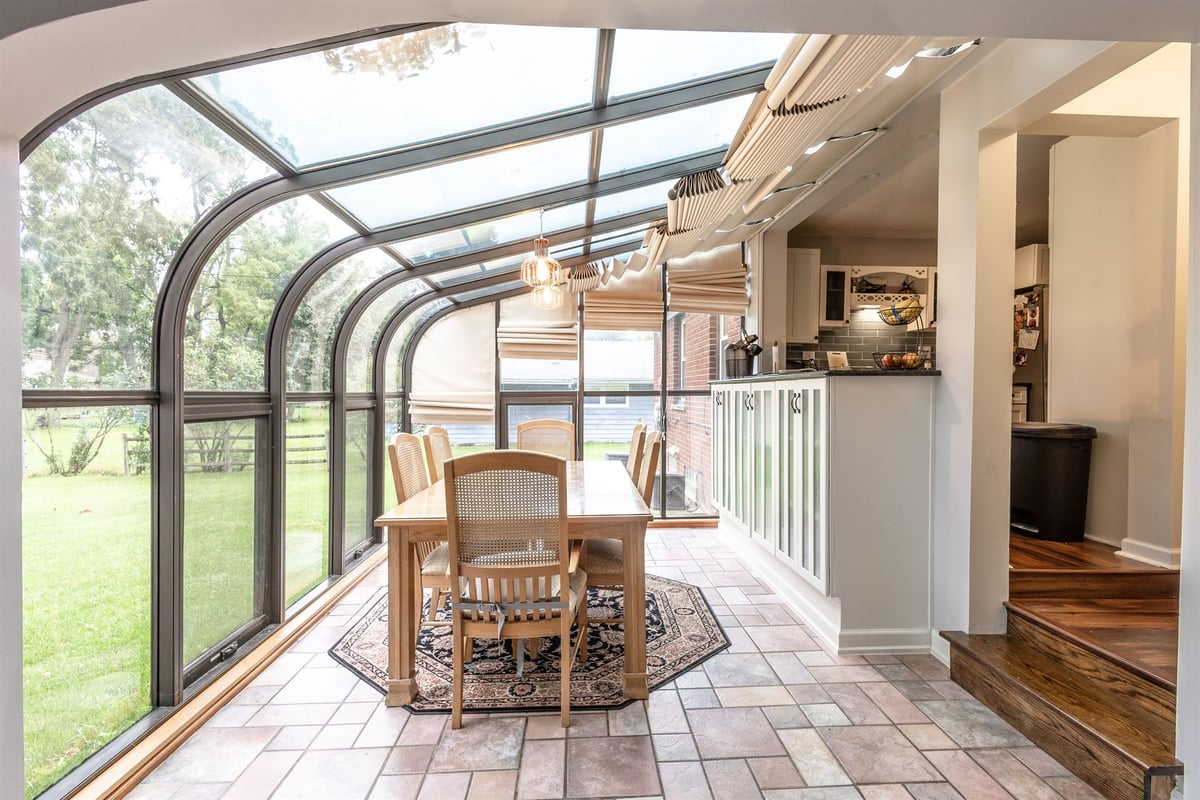 curved-glass-sunroom-renovation-with-a-terracotta-tile-floor-grosse-ile-mi-optimized