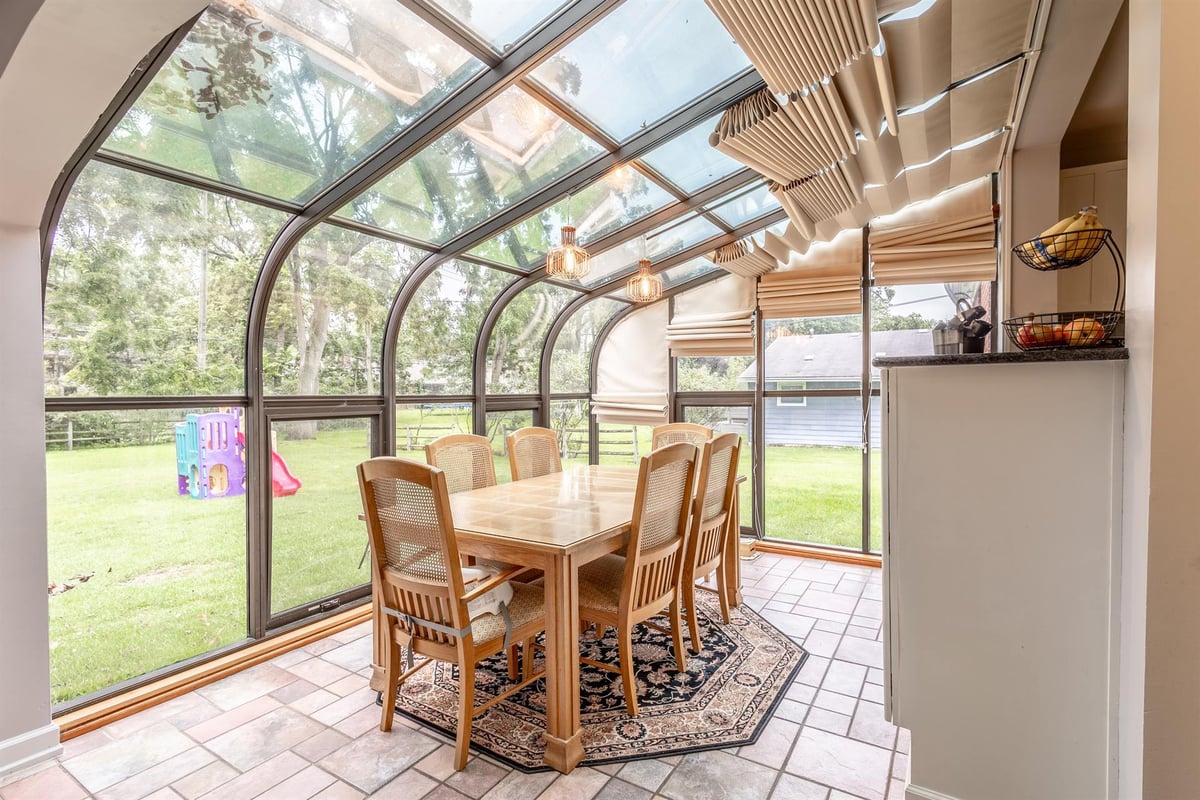 curved-glass-sunroom-renovation-with-backyard-views-grosse-ile-mi-optimized