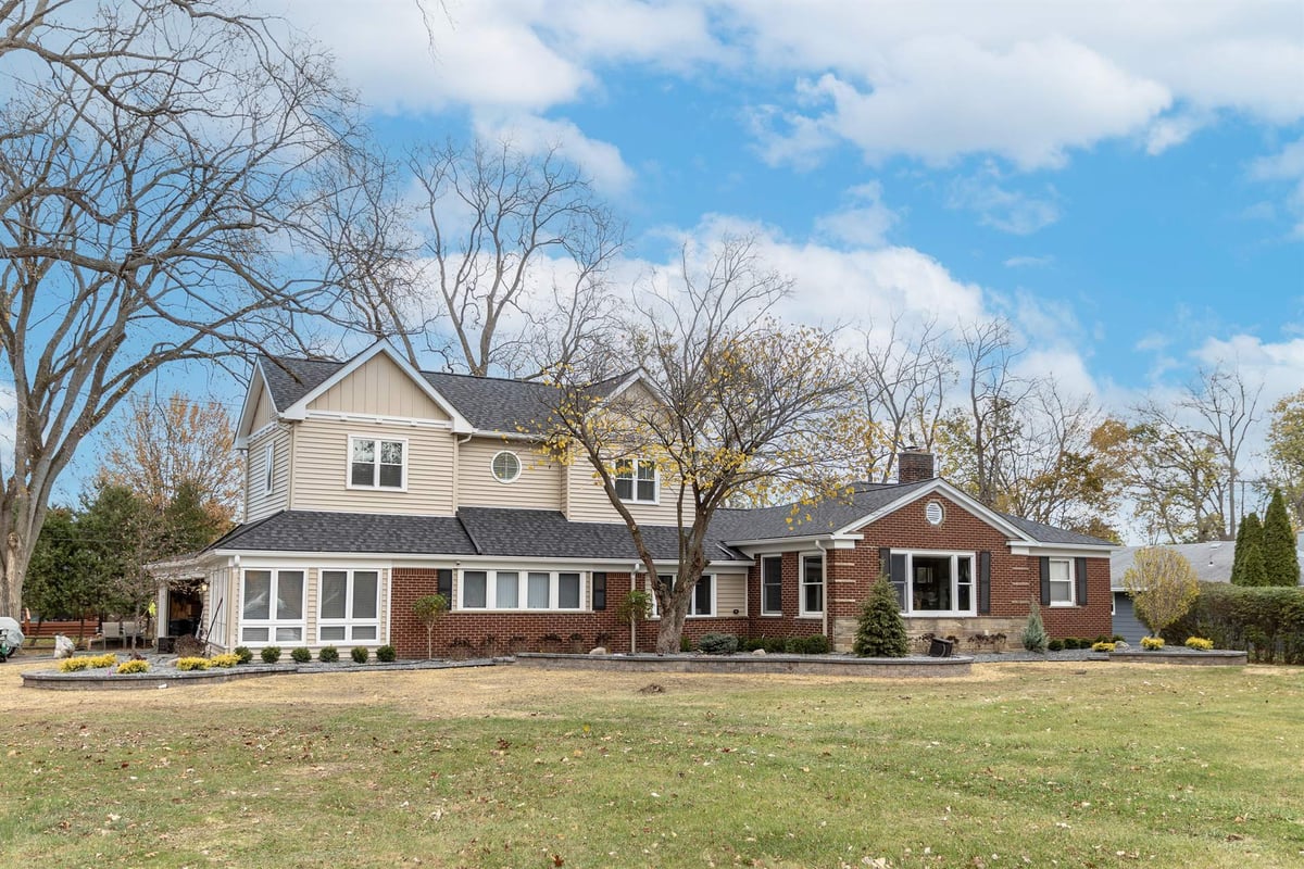 front-elevation-after-renovation-with-the-addition-sunroom-and-landscaping-grosse-ile-mi-optimized