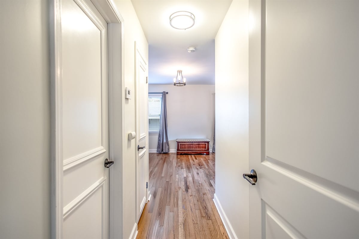 hallway-after-renovation-looking-into-a-room-with-hardwood-floors-grosse-ile-mi-optimized