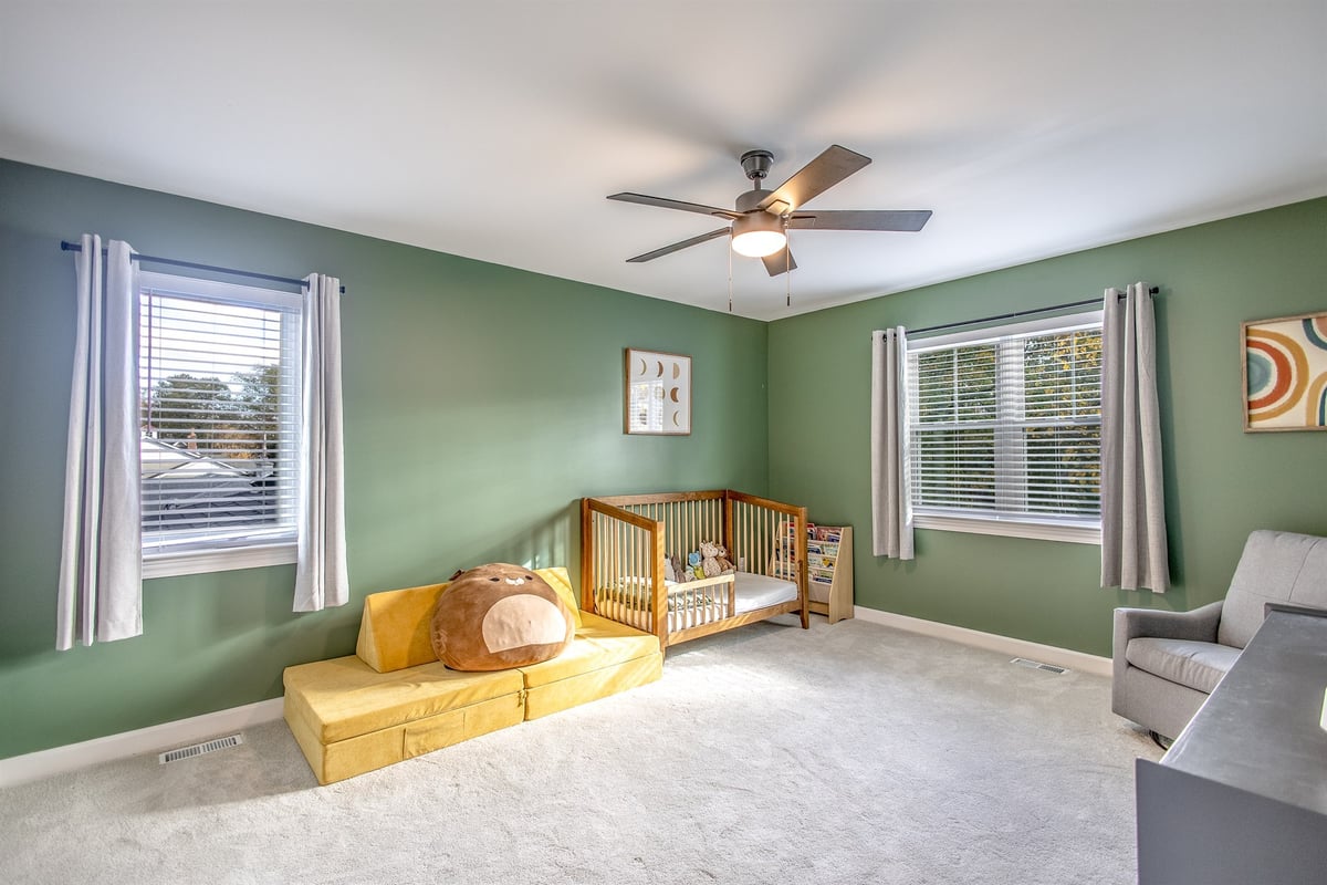 nursery-after-renovation-with-a-green-accent-wall-and-carpet-grosse-ile-mi-optimized