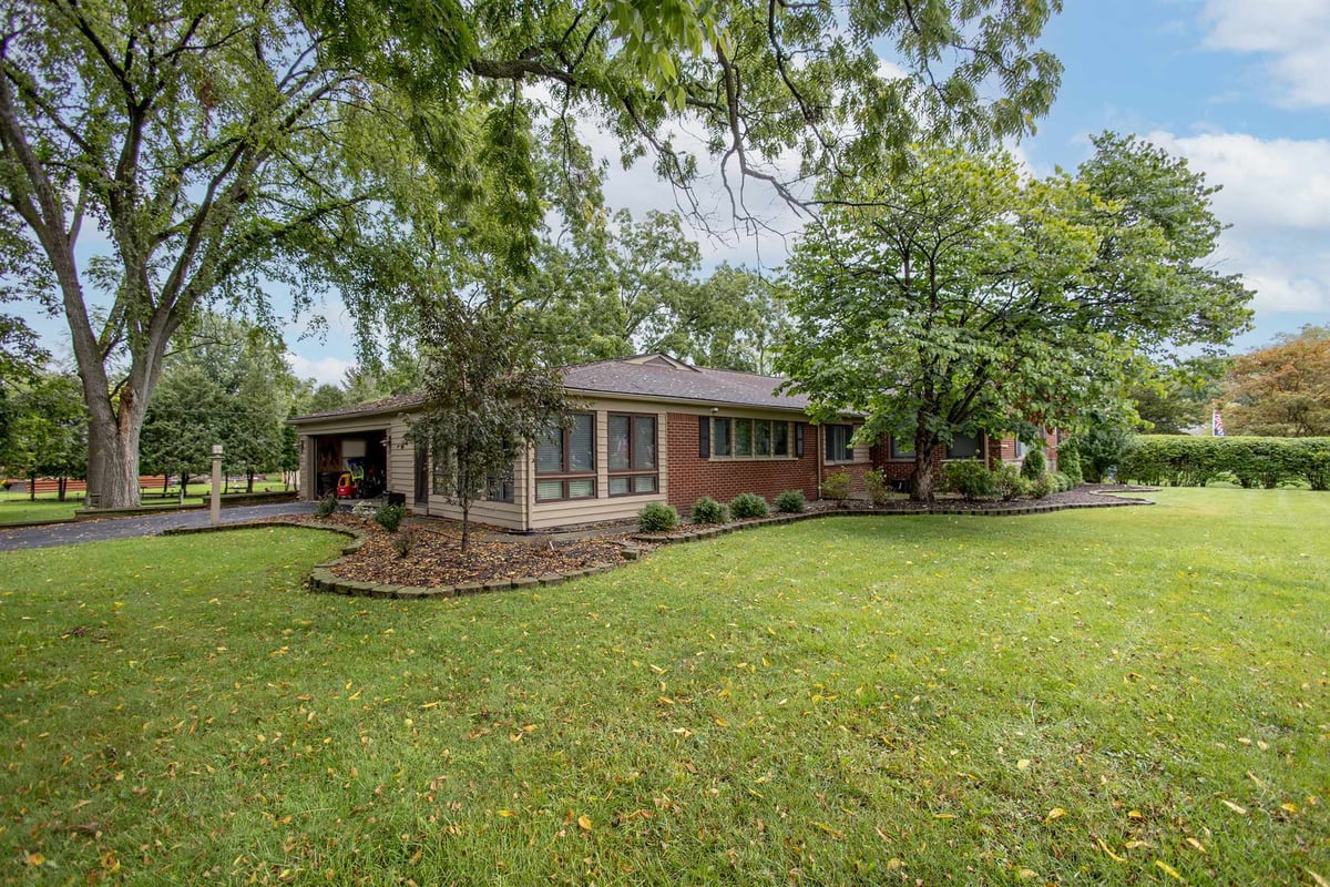front-angle-before-renovation-of-a-brick-ranch-with-a-sunroom-grosse-ile-mi-optimized