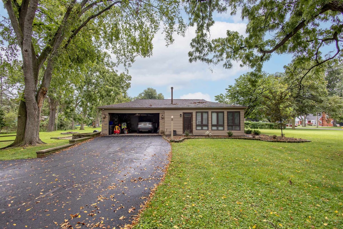 front-elevation-before-renovation-of-a-brick-ranch-with-a-garage-grosse-ile-mi-optimized