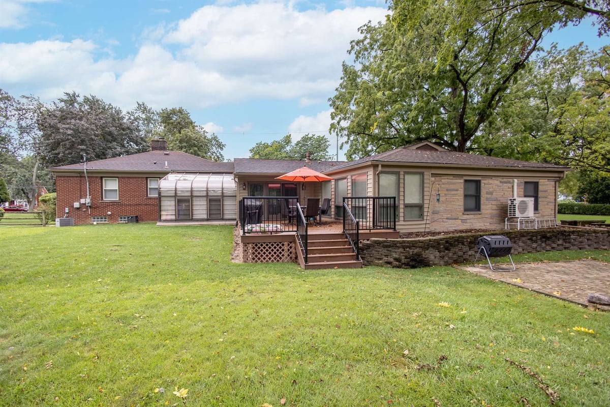 rear-and-side-before-renovation-with-a-sunroom-and-deck-grosse-ile-mi-optimized
