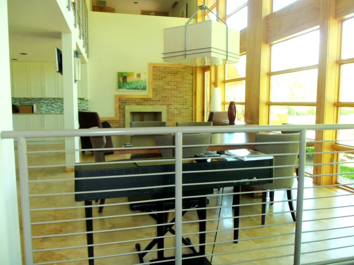 contemporary-home-interior-floor-to-ceiling-windows-and-brick-fireplace-farmington-hills-mi-optimized
