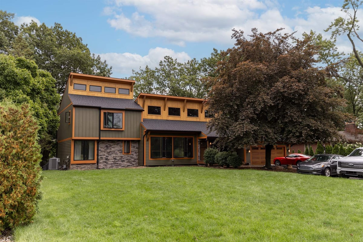 contemporary-two-story-home-with-olive-board-and-batten-siding-cedar-accents-and-stone-veneer-entr-southeast-mi-optimized