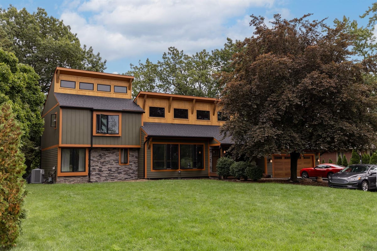 front-elevation-of-a-contemporary-home-with-cedar-trim-stone-veneer-and-clerestory-windows-southeast-mi-optimized