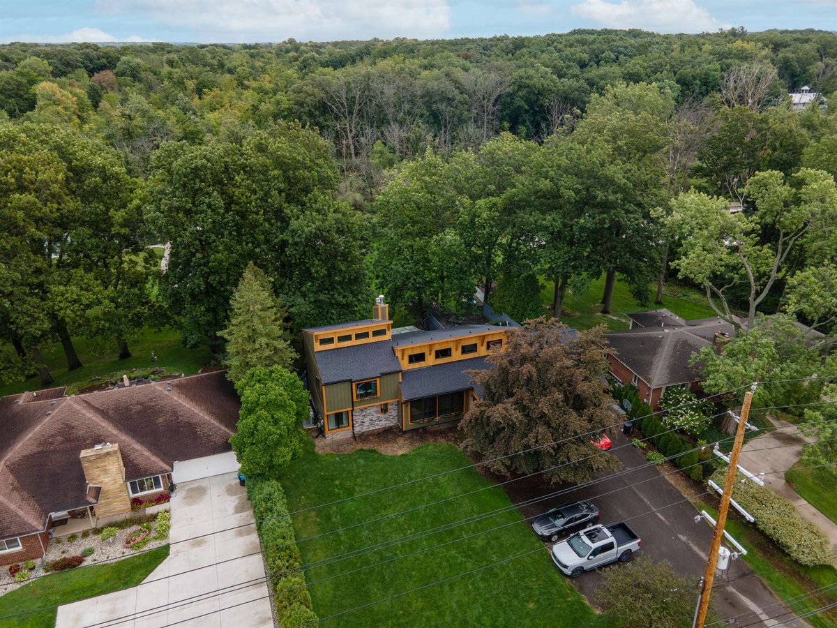high-aerial-view-of-a-contemporary-home-nestled-in-a-wooded-neighborhood-southeast-mi-optimized