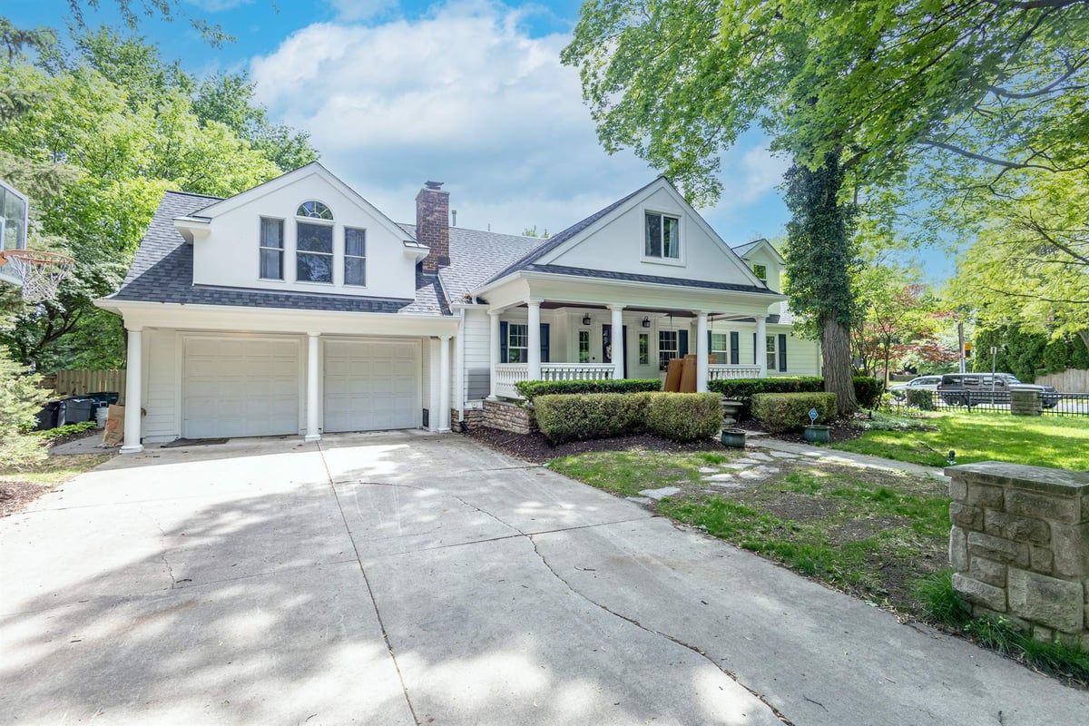 driveway-and-detached-two-car-garage-beside-the-covered-front-porch-southeast-mi-optimized