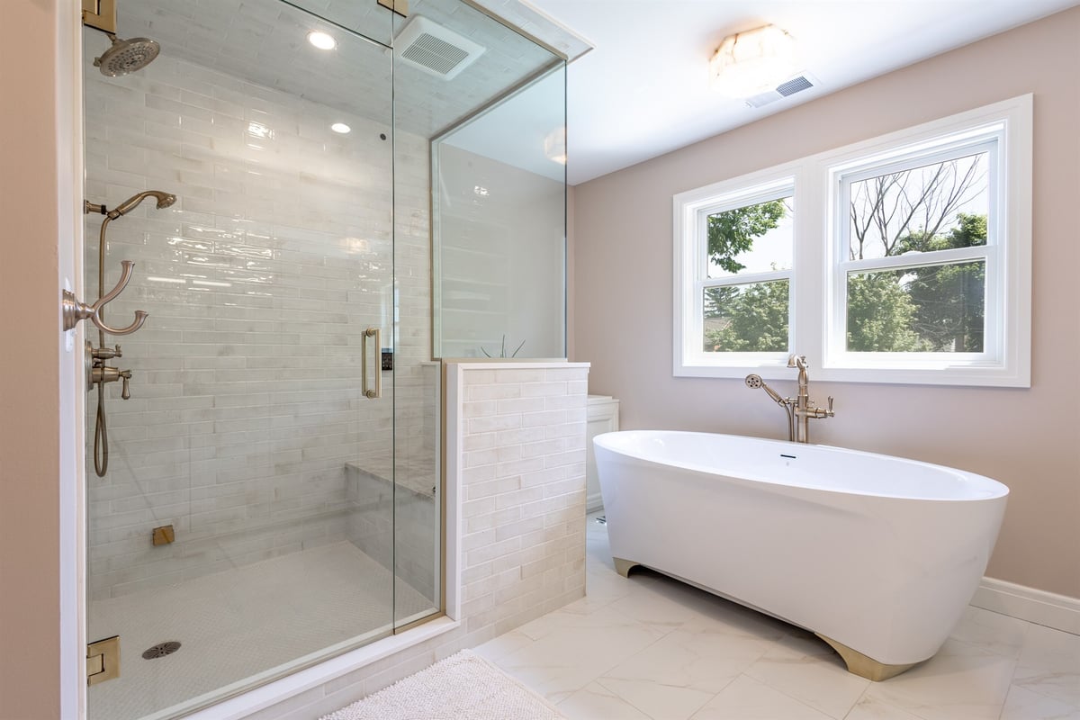 master-bath-with-a-glass-shower-freestanding-tub-and-gold-fixtures-southeast-mi-optimized