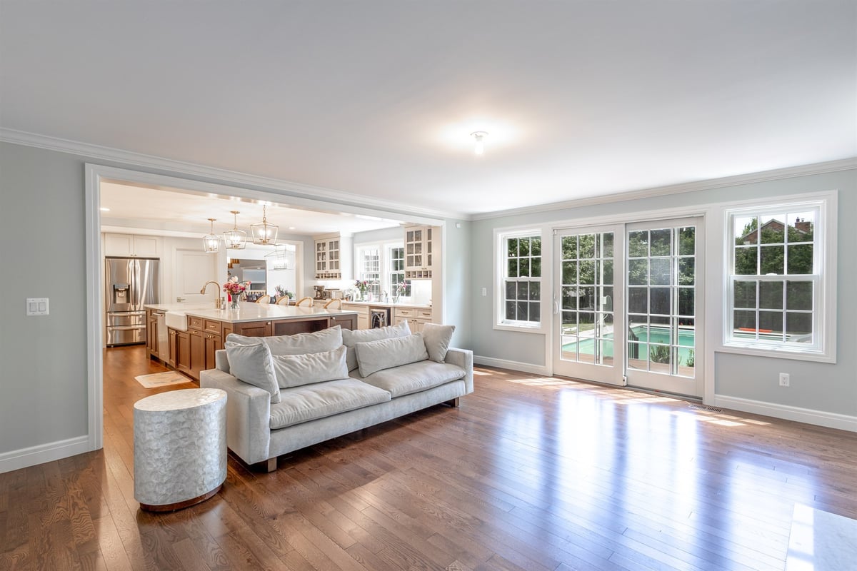open-family-room-flowing-into-the-kitchen-with-pool-views-southeast-mi-optimized