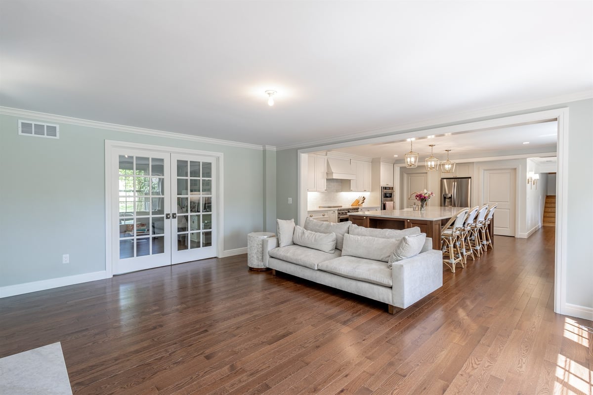 open-living-room-into-the-kitchen-with-french-doors-and-hardwood-southeast-mi-optimized