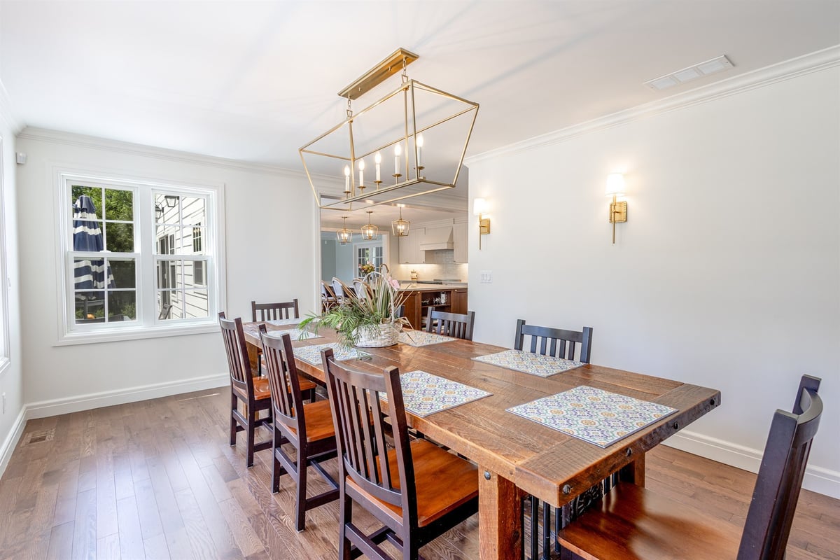 renovated-dining-room-with-a-reclaimed-wood-table-and-geometric-brass-chandelier-southeast-mi-optimized
