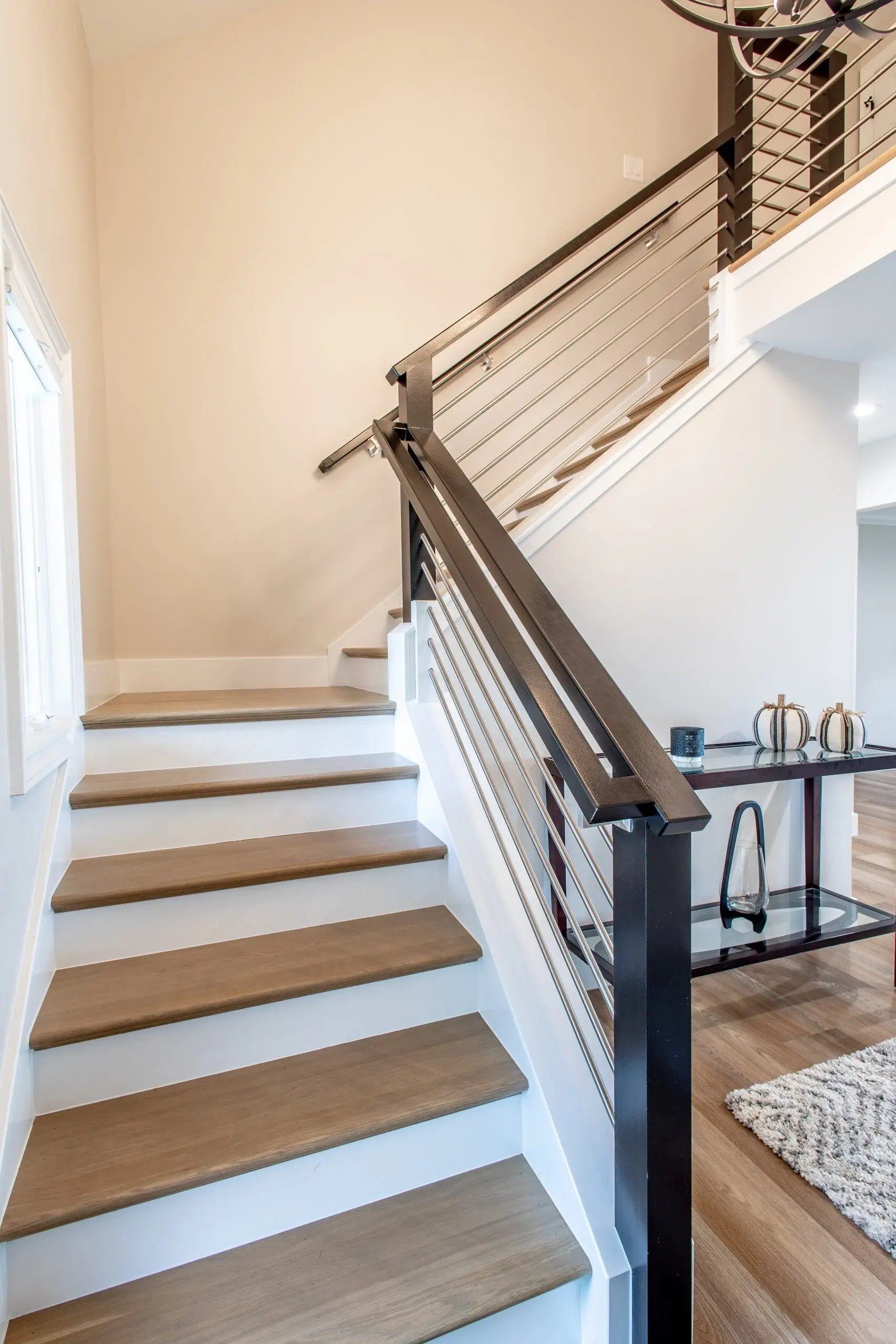whole home renovation with modern staircase and custom railing in grosse ile