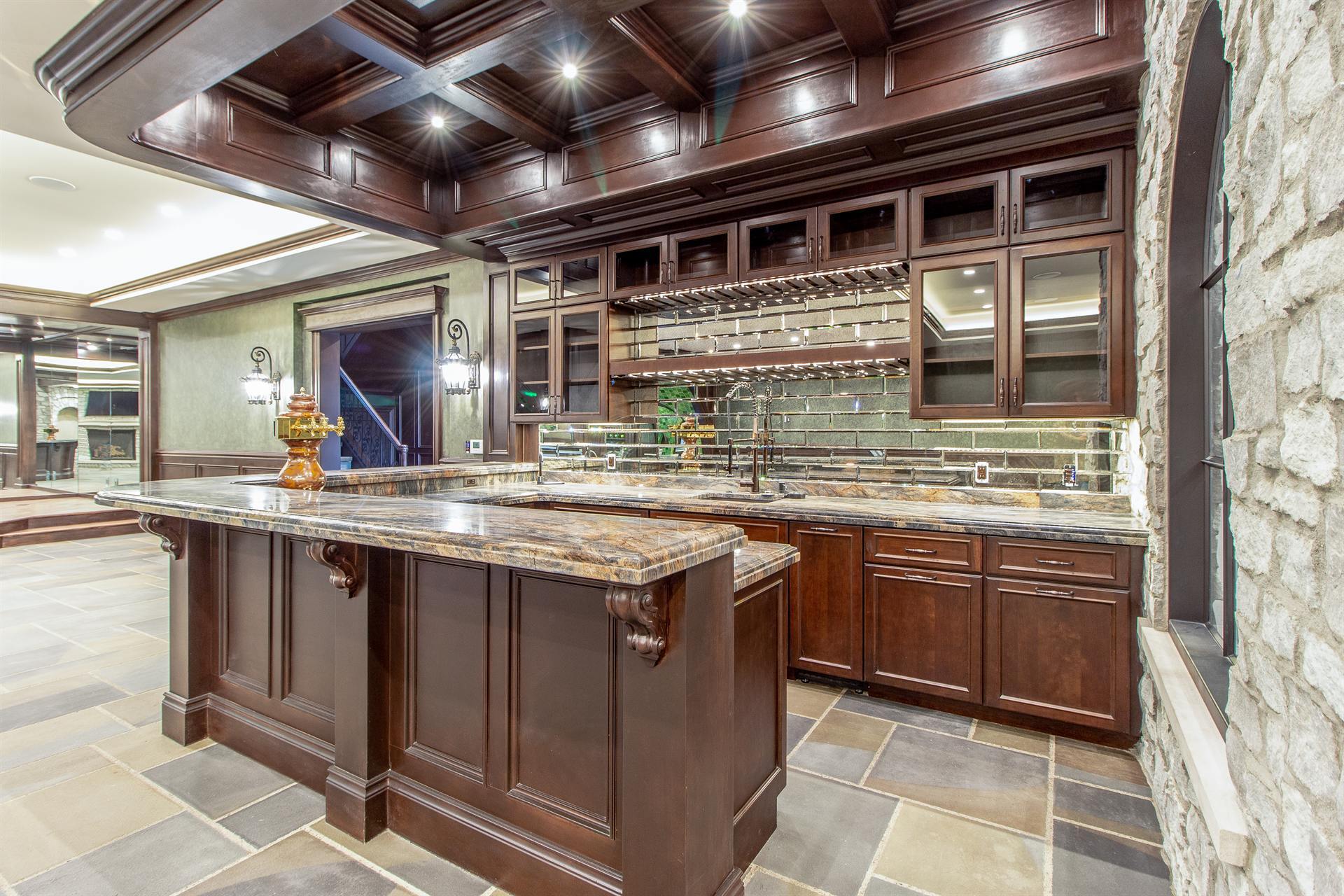basement-bar-island-with-a-granite-top-and-tile-backsplash-southeast-mi-optimized