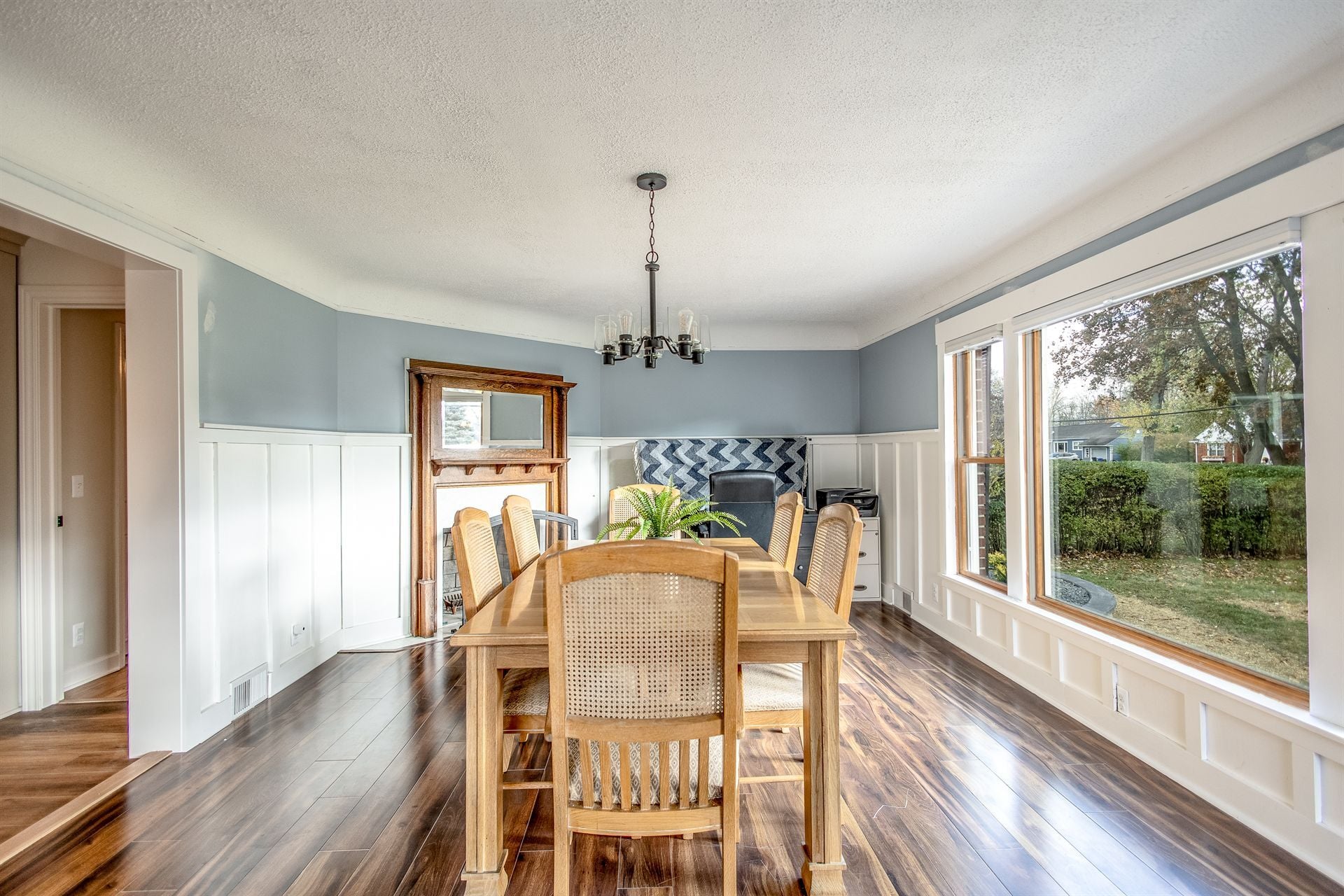 dining-room-after-renovation-with-blue-walls-and-a-bay-window-grosse-ile-mi-optimized