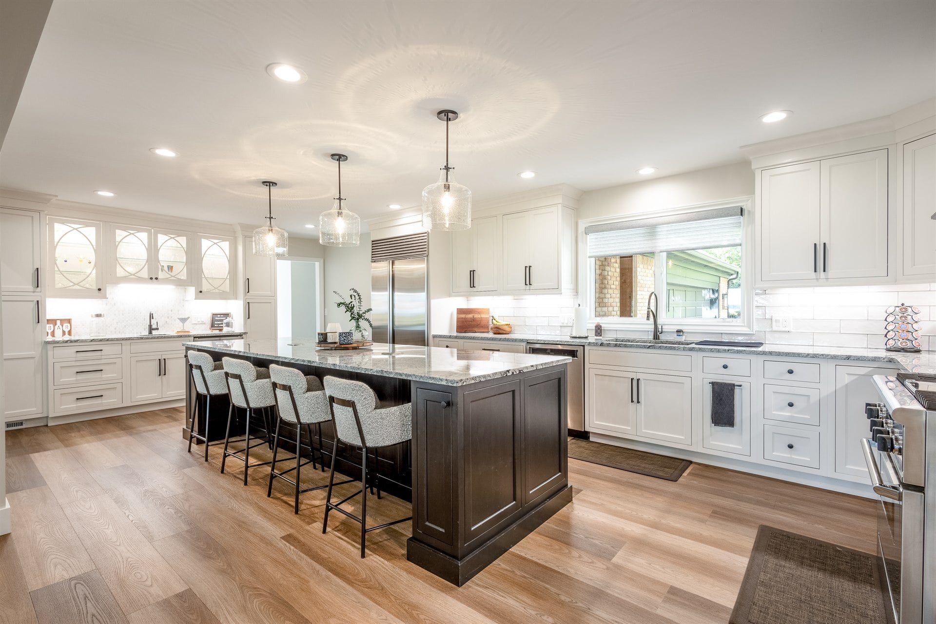 white-kitchen-with-a-dark-island-pendant-lights-and-subway-tile-backsplash-southeast-mi-optimized