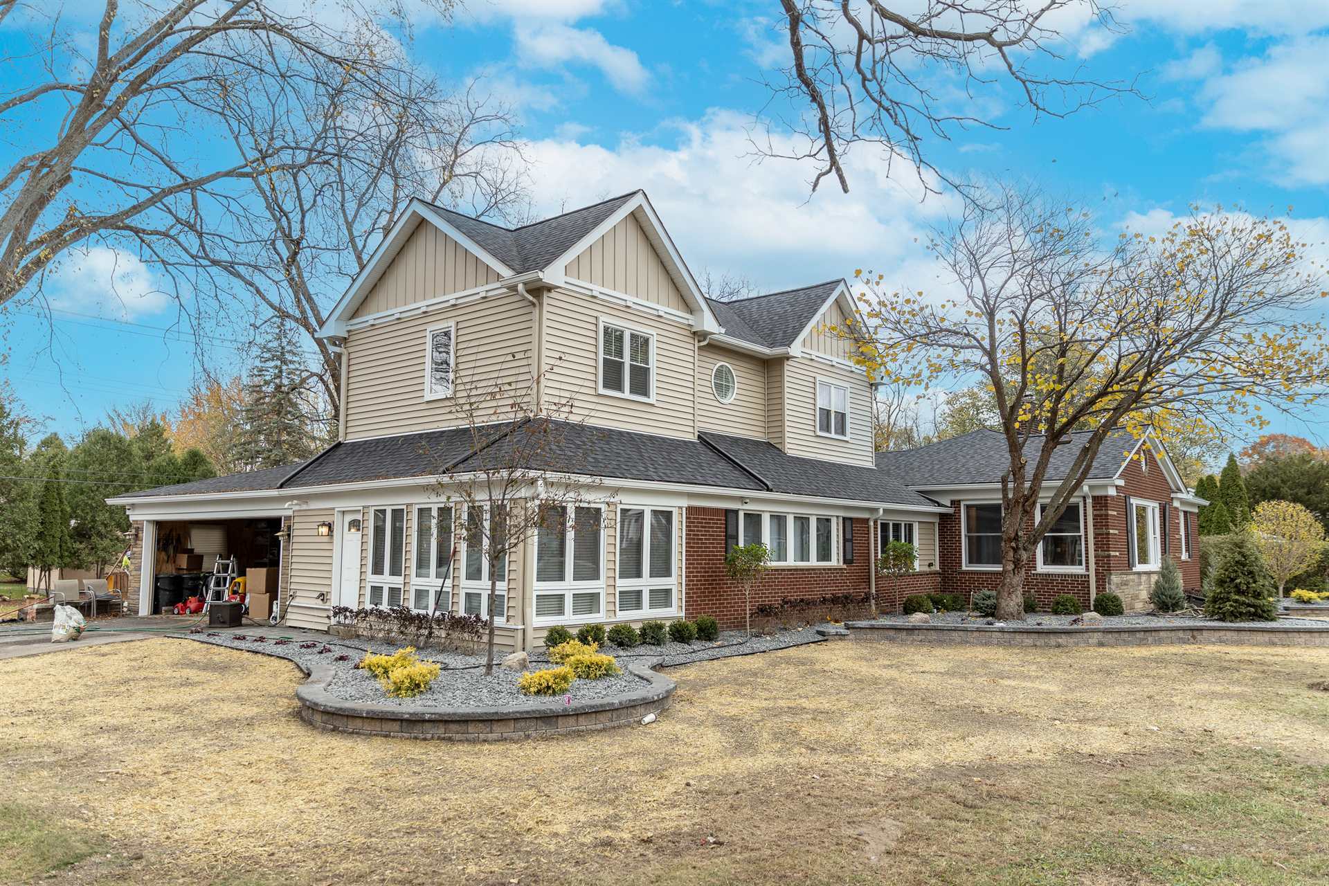 front-angle-after-renovation-with-the-two-story-addition-and-sunroom-grosse-ile-mi-optimized
